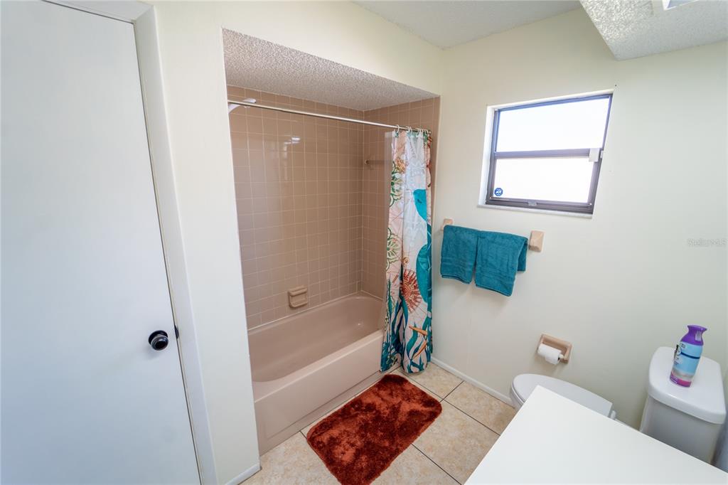 1394 Escobar Avenue Spring Hill, FL 34608 - Photo 27 of 47 a bathroom with a bathtub and a shower