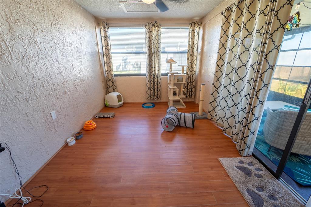1394 Escobar Avenue Spring Hill, FL 34608 - Photo 28 of 47 a living room with furniture and a fireplace