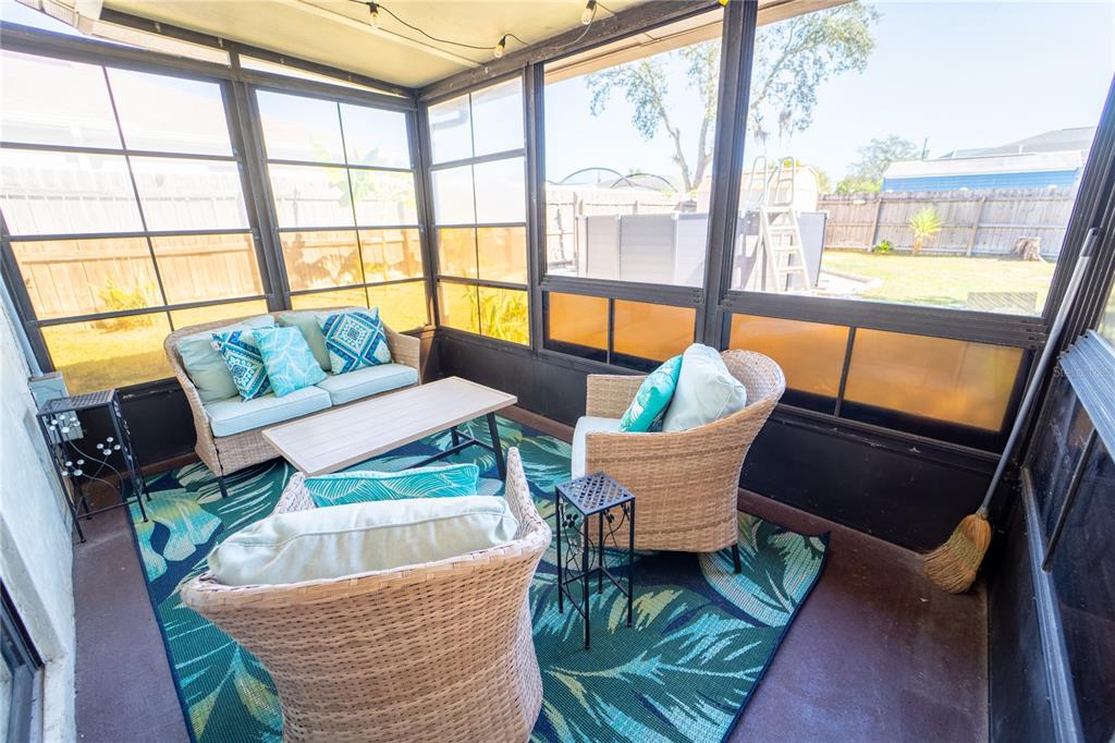 1394 Escobar Avenue Spring Hill, FL 34608 - Photo 29 of 47 a living room with furniture and a large window