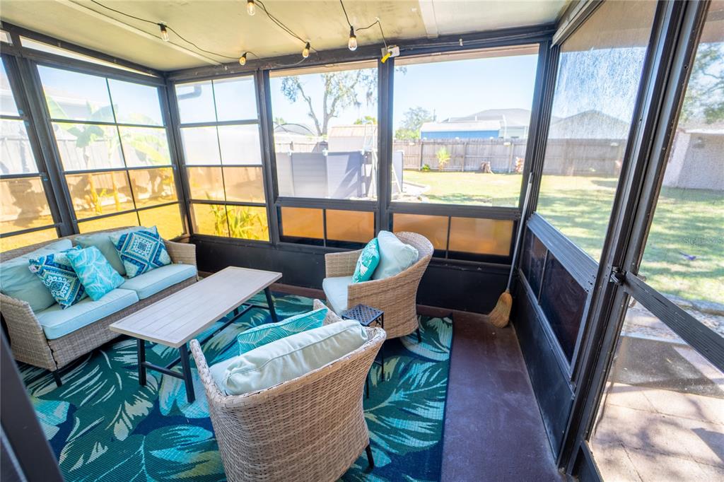 1394 Escobar Avenue Spring Hill, FL 34608 - Photo 30 of 47 a living room with furniture and a large window