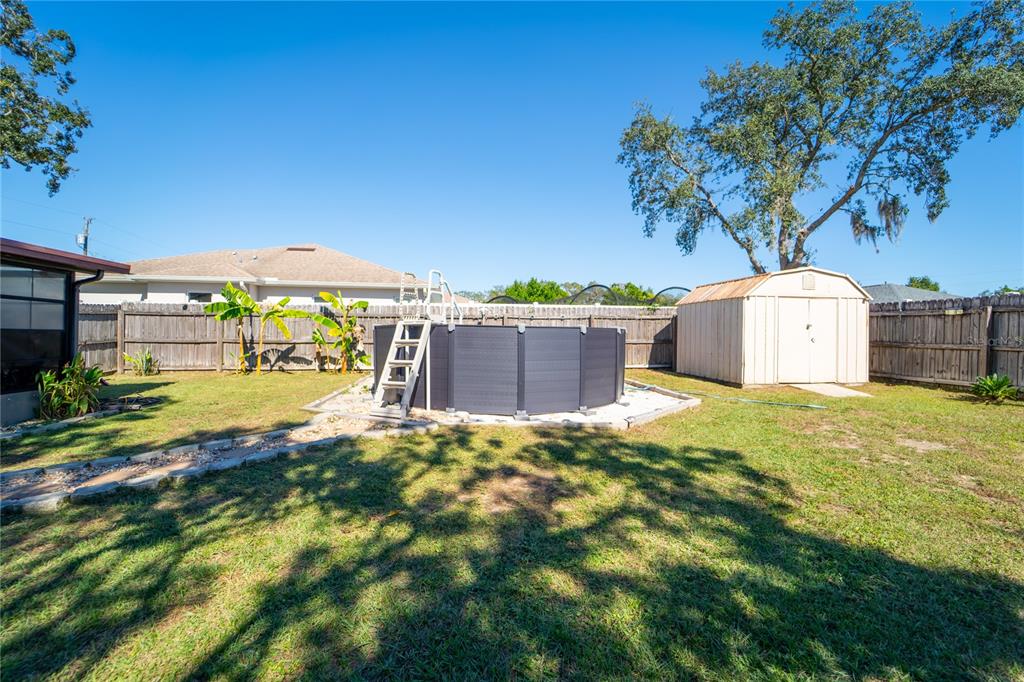 1394 Escobar Avenue Spring Hill, FL 34608 - Photo 35 of 47 a front view of a house with garden