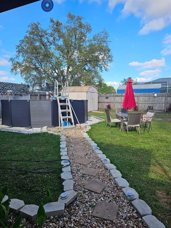 1394 Escobar Avenue Spring Hill, FL 34608 - Photo 38 of 47 a garden view with a seating space