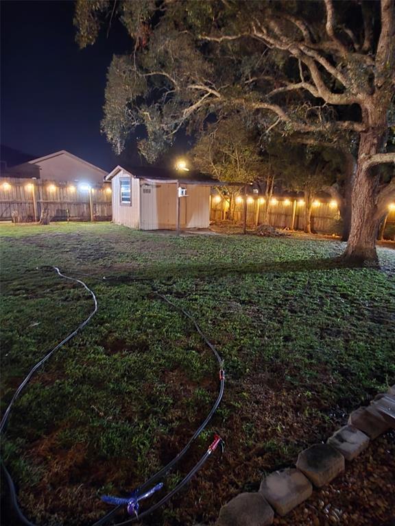 1394 Escobar Avenue Spring Hill, FL 34608 - Photo 41 of 47 a view of a chairs in a yard