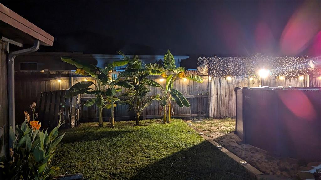 1394 Escobar Avenue Spring Hill, FL 34608 - Photo 42 of 47 a view of a house with a yard