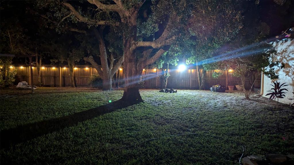 1394 Escobar Avenue Spring Hill, FL 34608 - Photo 44 of 47 a front view of a house with a yard