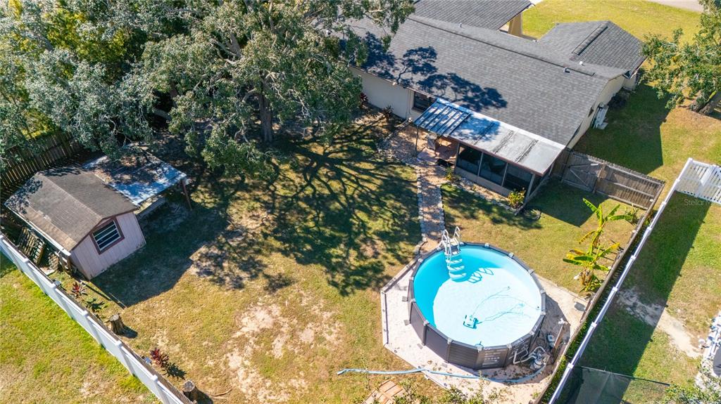 1394 Escobar Avenue Spring Hill, FL 34608 - Photo 9 of 47 an aerial view of a house with a swimming pool