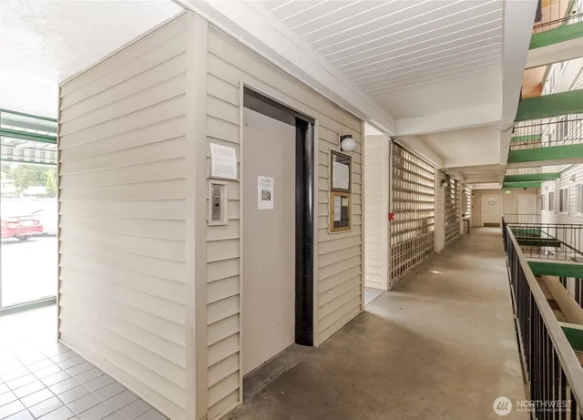 a view of a hallway with seating area