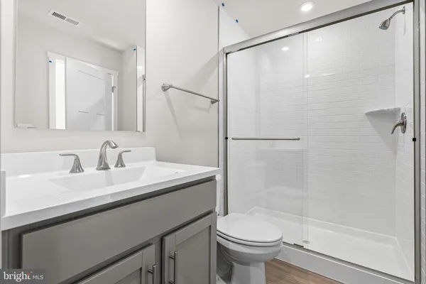 a bedroom with a bed and a potted plant