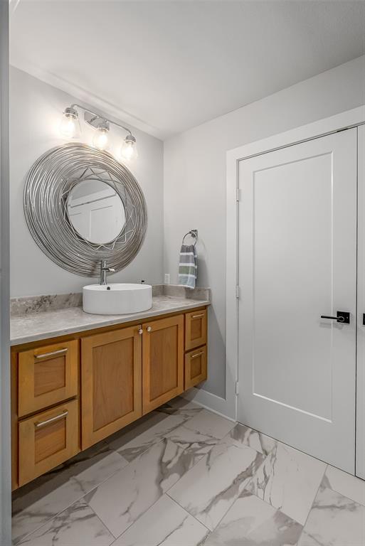 128 Knott Drive Many, LA 71449 - Photo 18 of 39 a bathroom with a granite countertop sink a mirror and