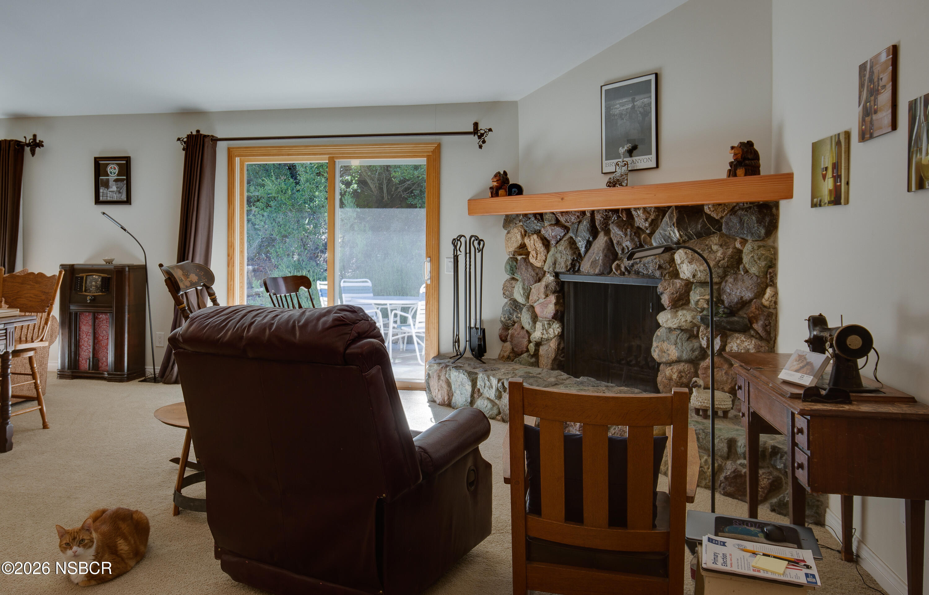 850 Fredensborg Canyon Road Solvang, CA 93463 - Photo 5 of 26 a living room with furniture and a fireplace