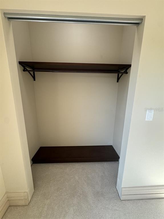 8351 Southwest 14th Lane Okeechobee, FL 34974 - Photo 20 of 46 a view of walk in closet with clothes