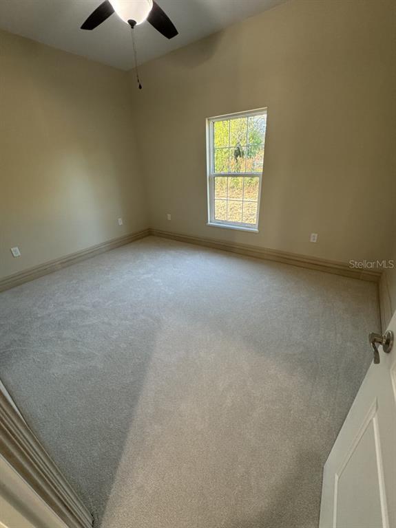 8351 Southwest 14th Lane Okeechobee, FL 34974 - Photo 22 of 46 an empty room with a window