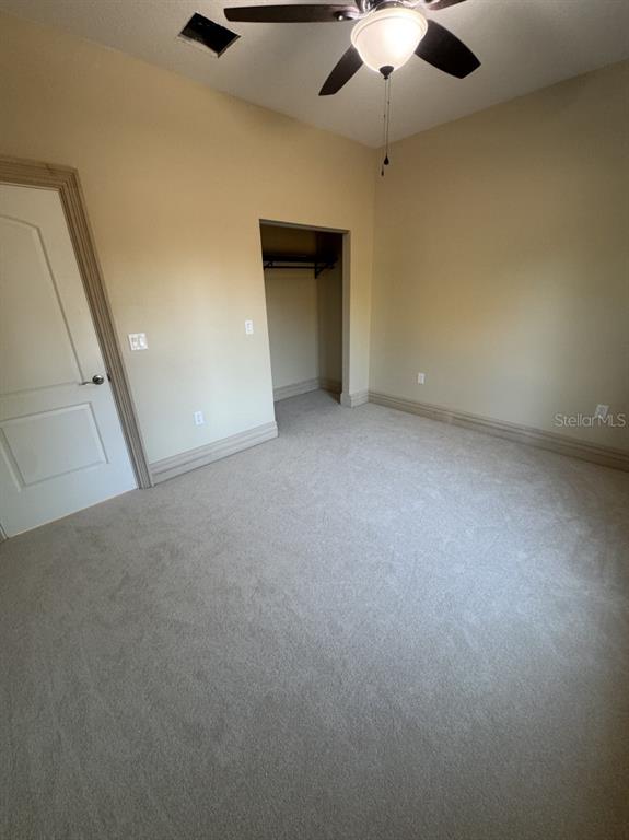 8351 Southwest 14th Lane Okeechobee, FL 34974 - Photo 23 of 46 a view of an empty room and a ceiling fan