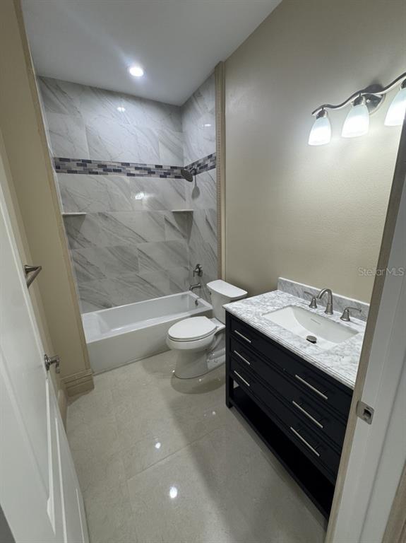 8351 Southwest 14th Lane Okeechobee, FL 34974 - Photo 24 of 46 a bathroom with a sink a toilet and shower