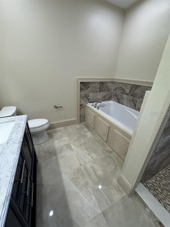 8351 Southwest 14th Lane Okeechobee, FL 34974 - Photo 27 of 46 a bathroom with a sink and a toilet