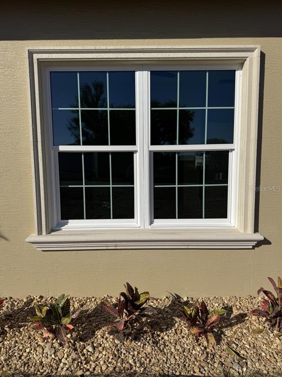 8351 Southwest 14th Lane Okeechobee, FL 34974 - Photo 5 of 46 a view of a window in a house