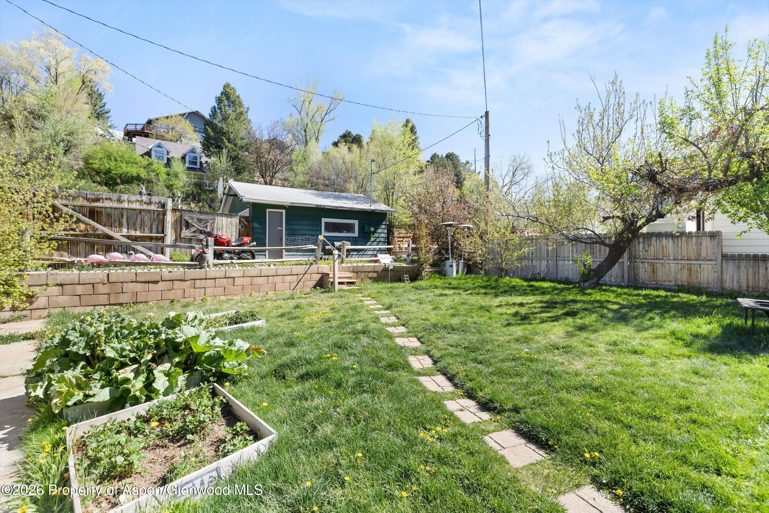 262 Midland Avenue Basalt, CO 81621 - Photo 5 of 10 a view of a yard with plants and a fountain