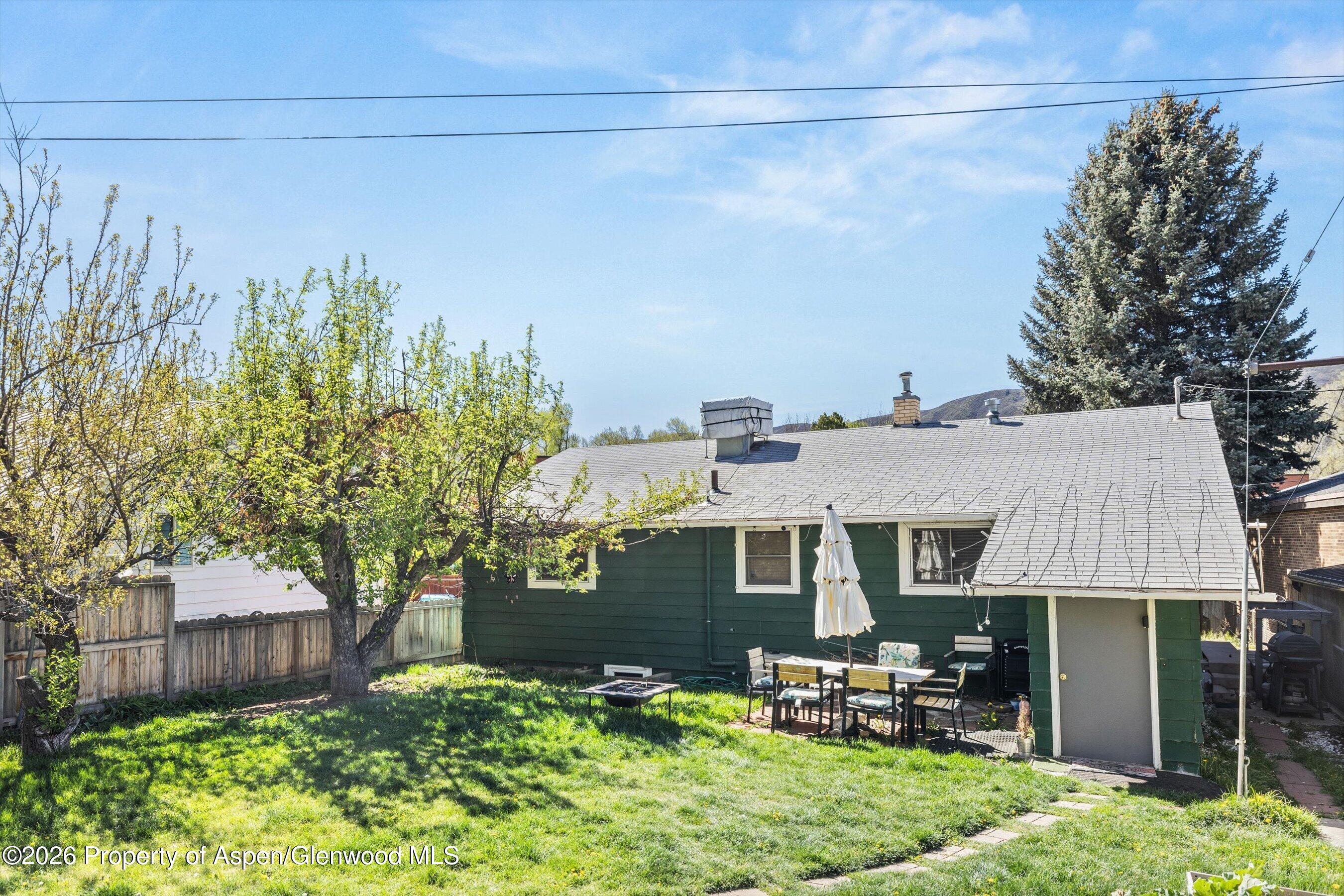 262 Midland Avenue Basalt, CO 81621 - Photo 6 of 10 a aerial view of a house with a yard table and chairs
