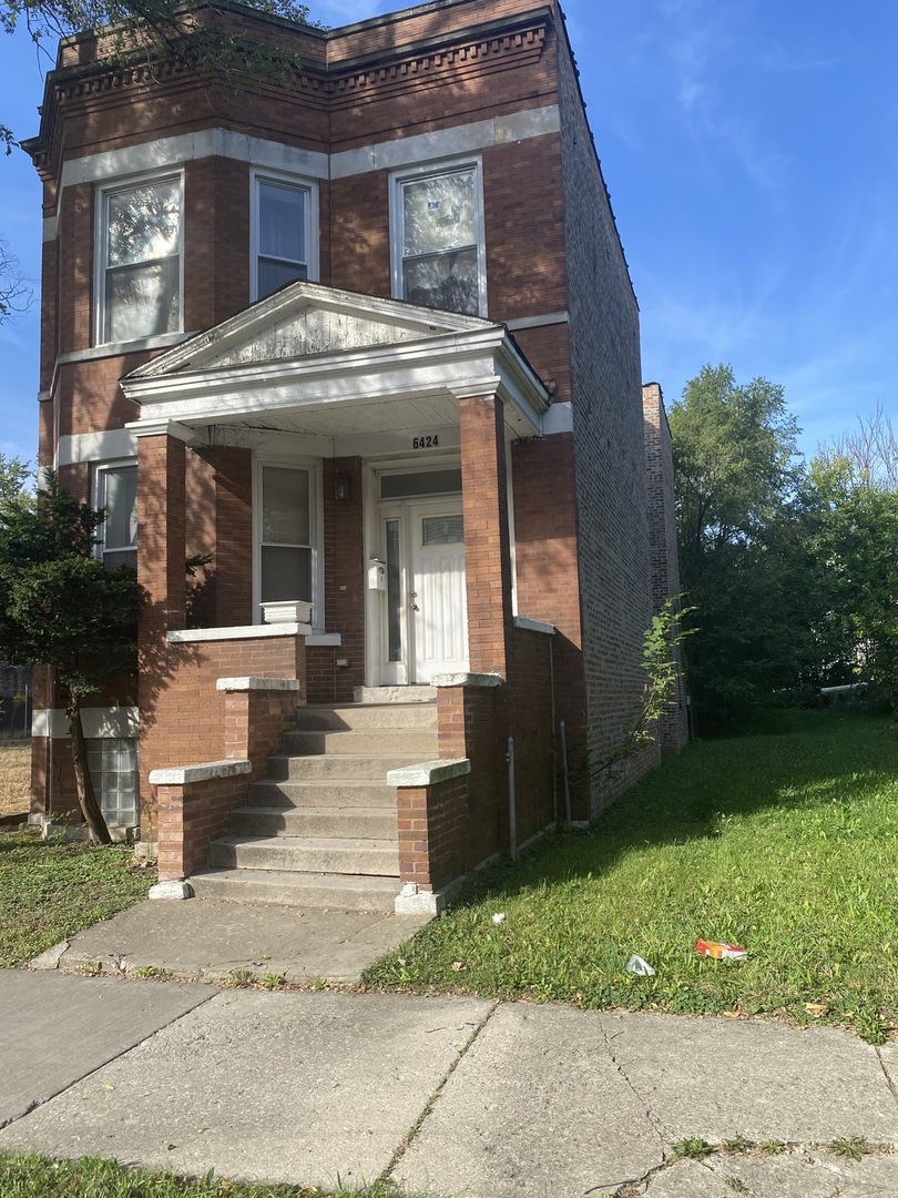6424 South Morgan Street, Unit 1 Chicago, IL 60621 - Photo 1 of 7 a front view of a house with garden