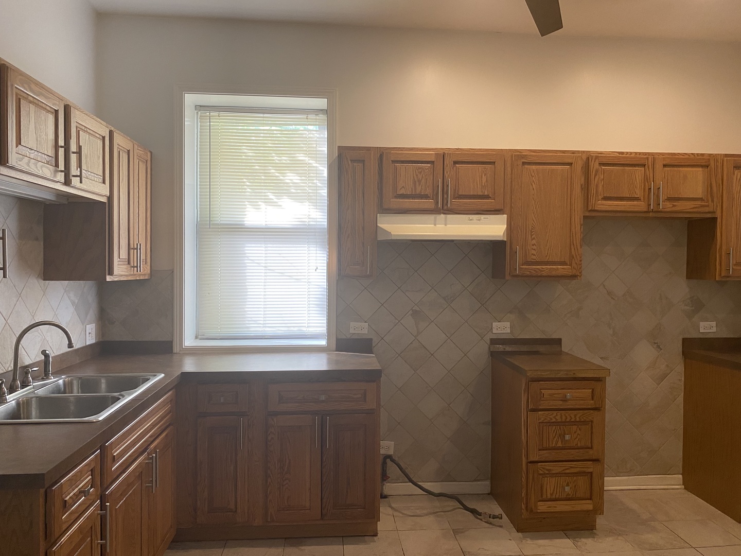 6424 South Morgan Street, Unit 1 Chicago, IL 60621 - Photo 2 of 7 a kitchen with a sink cabinets and a window