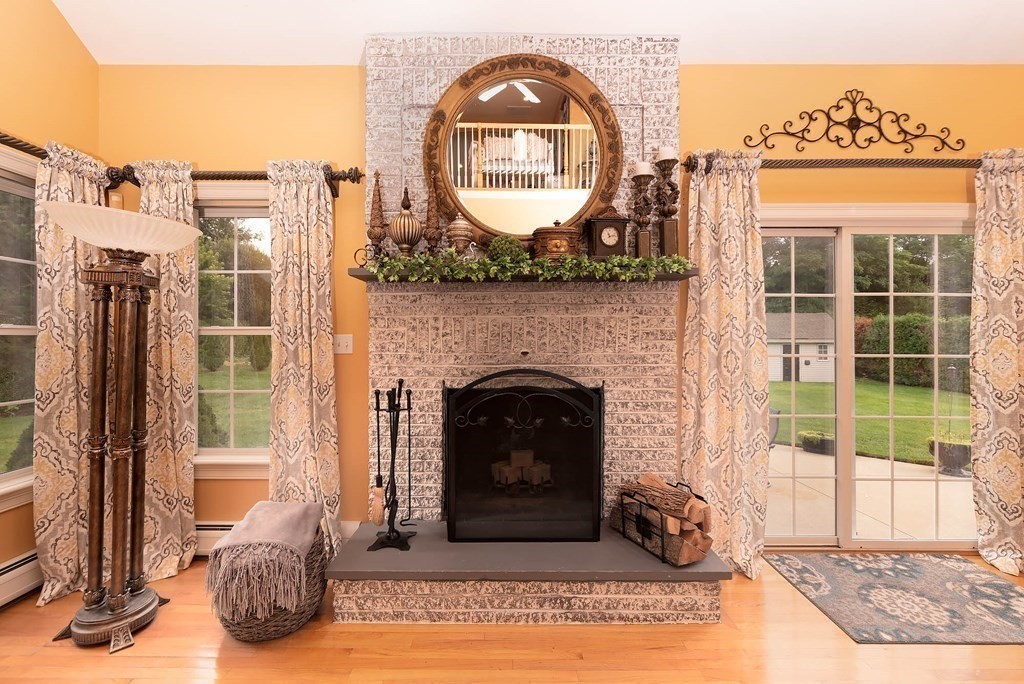 a view of a livingroom with furniture and a fireplace