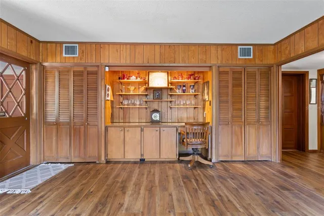 a living room with a fireplace a flat screen tv and a fireplace