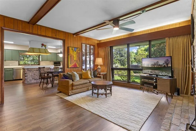 a dining room with a wooden table and chairs