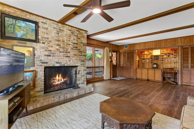 a kitchen with a stove a sink and a wooden cabinets
