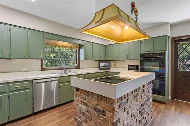 a kitchen with a sink and a large window
