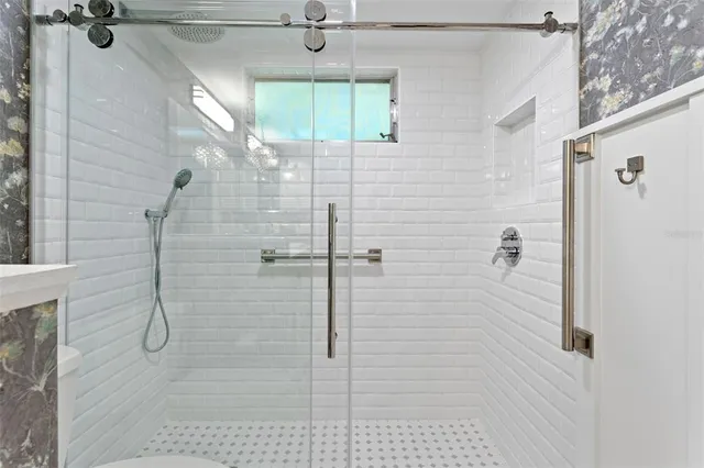 a bedroom with bed and window