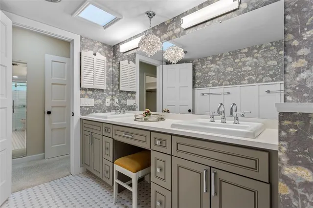 a spacious bedroom with a bed and a window