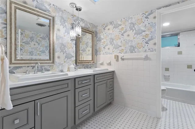 a view of a patio with table and chairs and potted plants