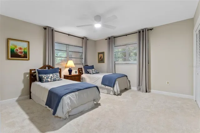 a view of backyard with a garden and trees