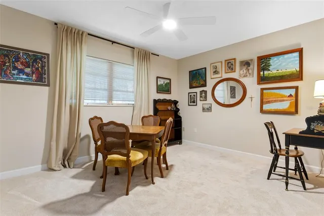 a front view of a house with a yard and potted plants