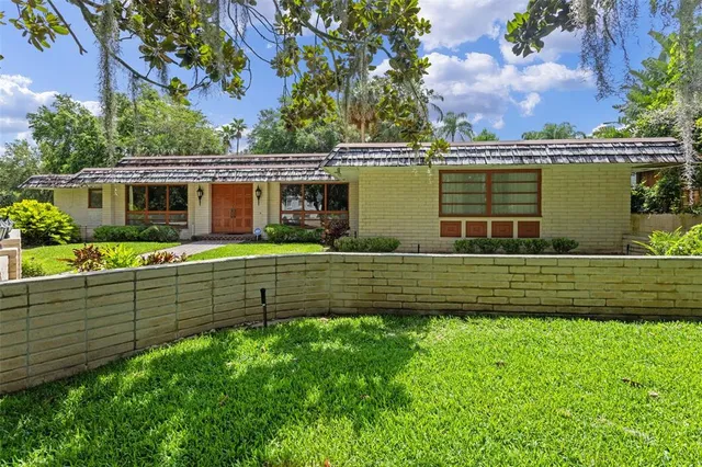 a view of a lake with a house in the background