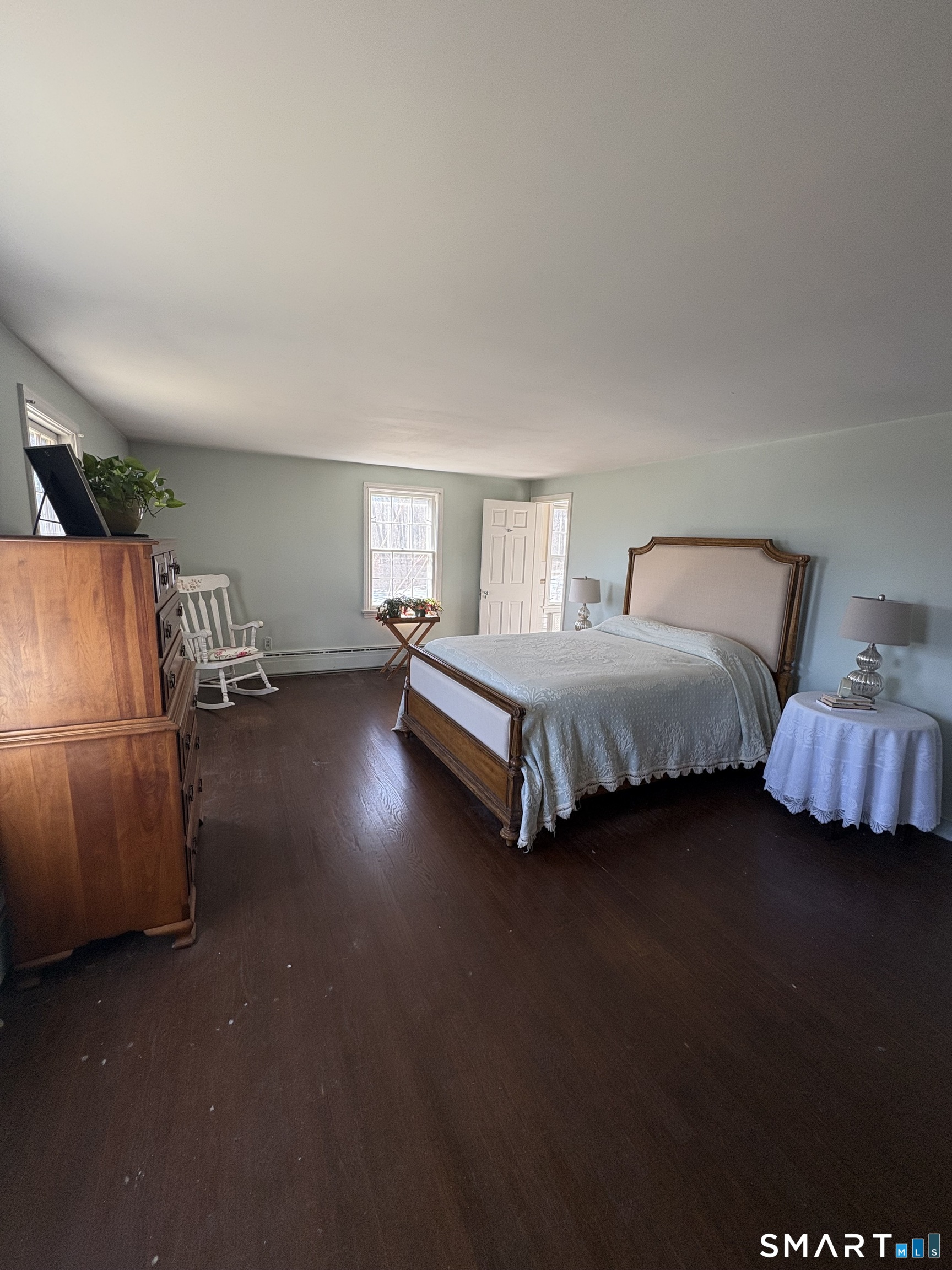 321 Artillery Road Middlebury, CT 06762 - Photo 11 of 15 a spacious bedroom with a bed and a couch