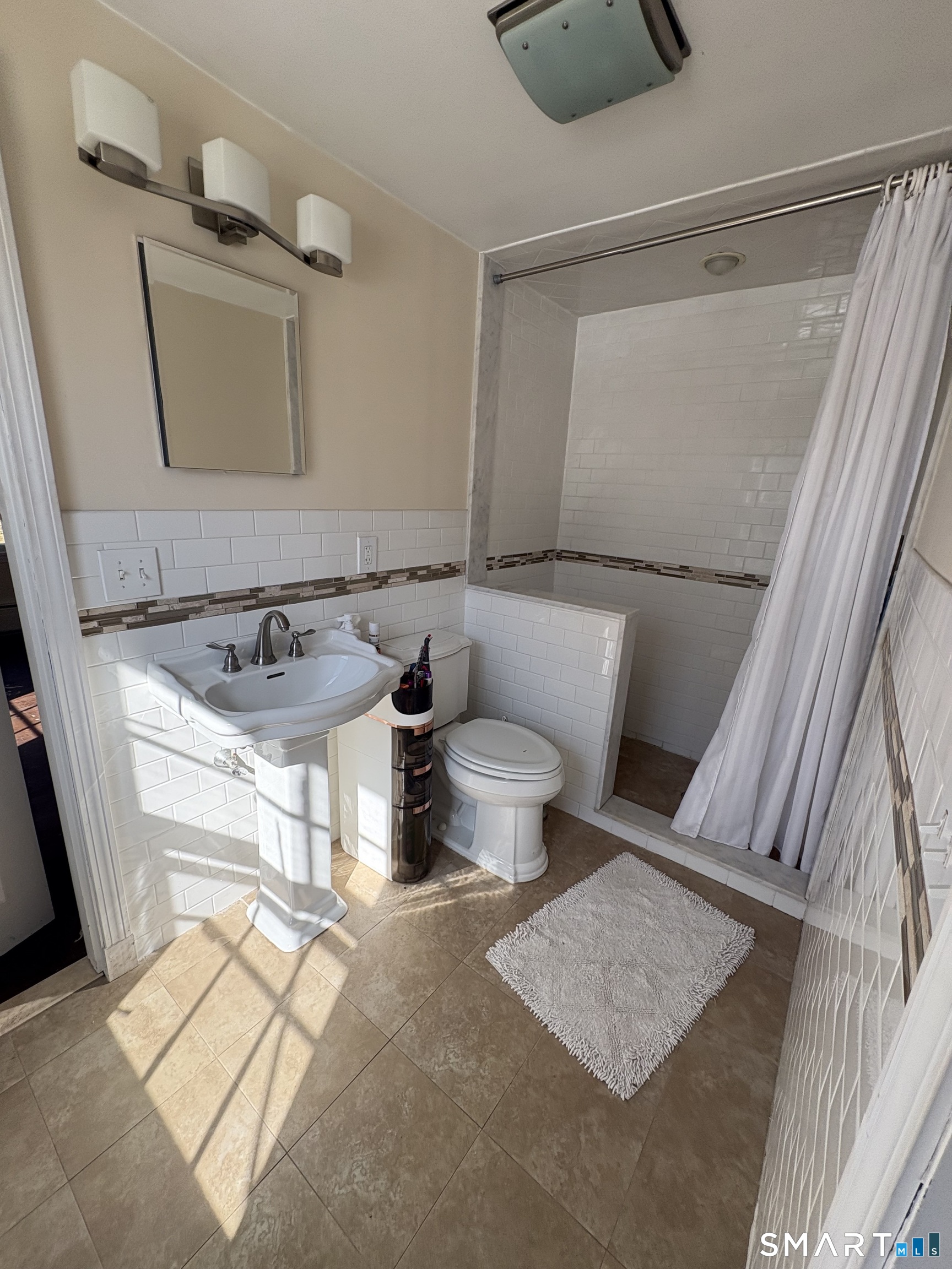 321 Artillery Road Middlebury, CT 06762 - Photo 12 of 15 a bathroom with a toilet sink and mirror