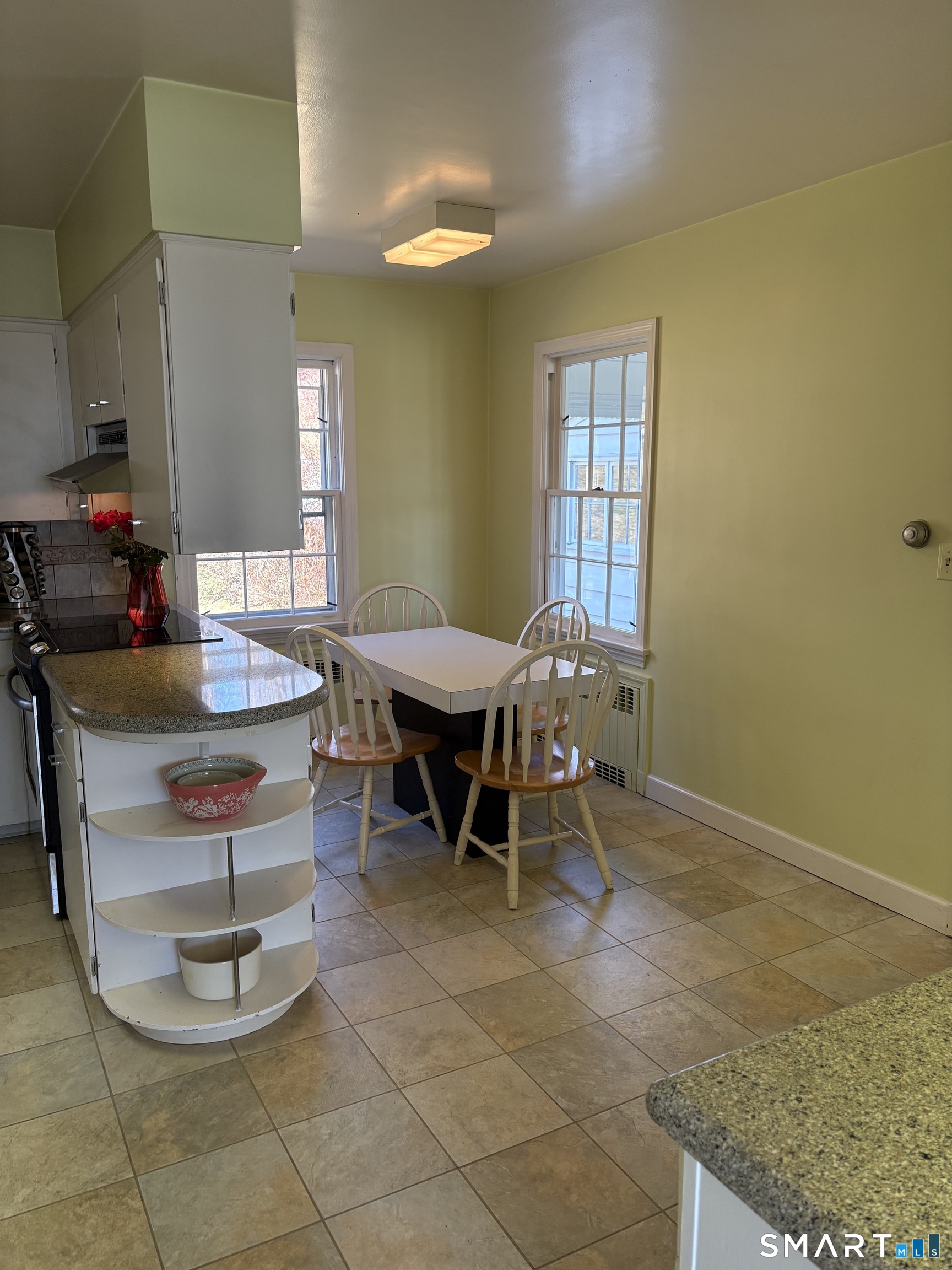 321 Artillery Road Middlebury, CT 06762 - Photo 14 of 15 a dining room with a table and chairs