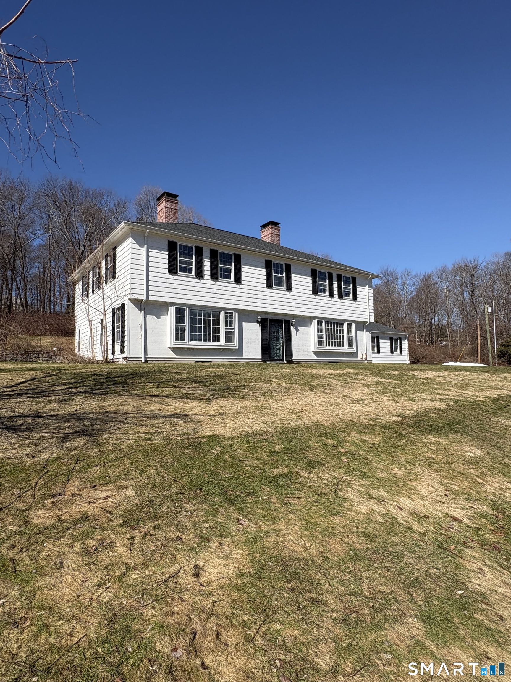 321 Artillery Road Middlebury, CT 06762 - Photo 2 of 15 a big house with large tree in front of it