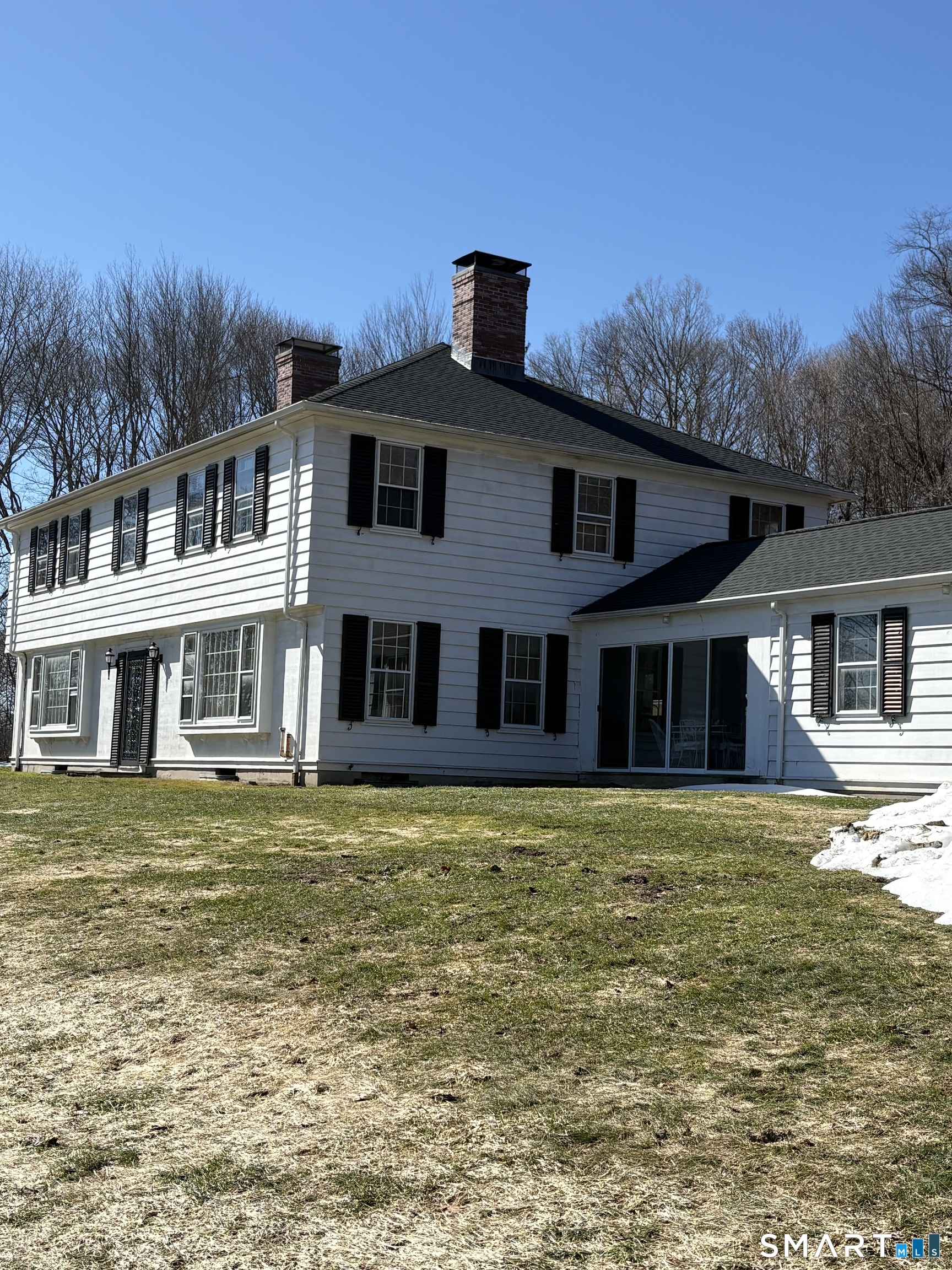 321 Artillery Road Middlebury, CT 06762 - Photo 3 of 15 a front view of a house with a garden