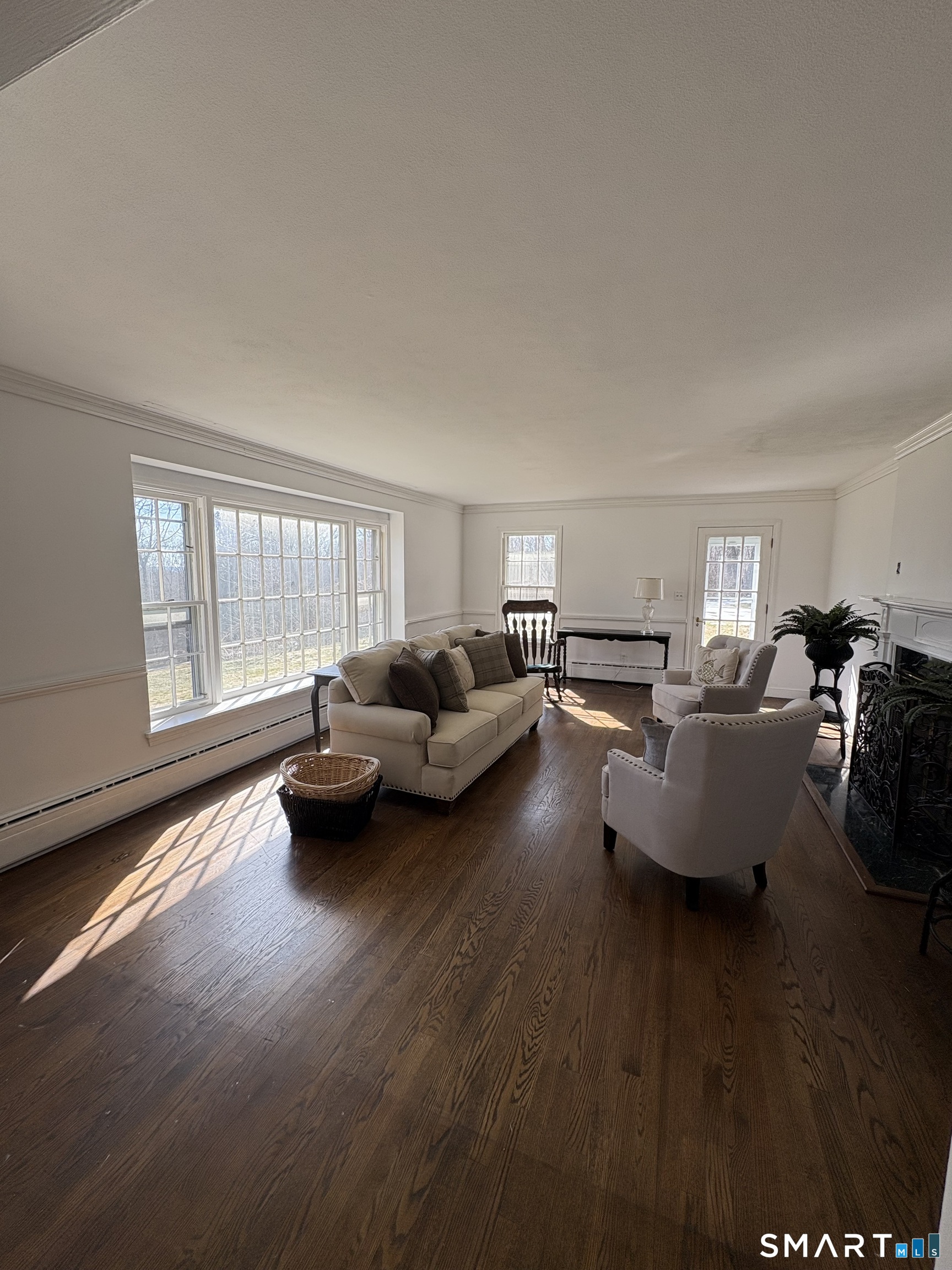 321 Artillery Road Middlebury, CT 06762 - Photo 5 of 15 a living room with furniture and a large window