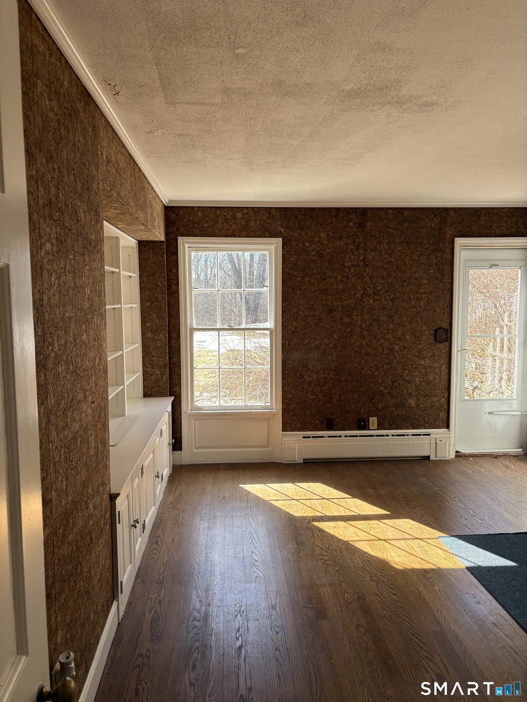 321 Artillery Road Middlebury, CT 06762 - Photo 7 of 15 a view of an empty room with a window and wooden floor