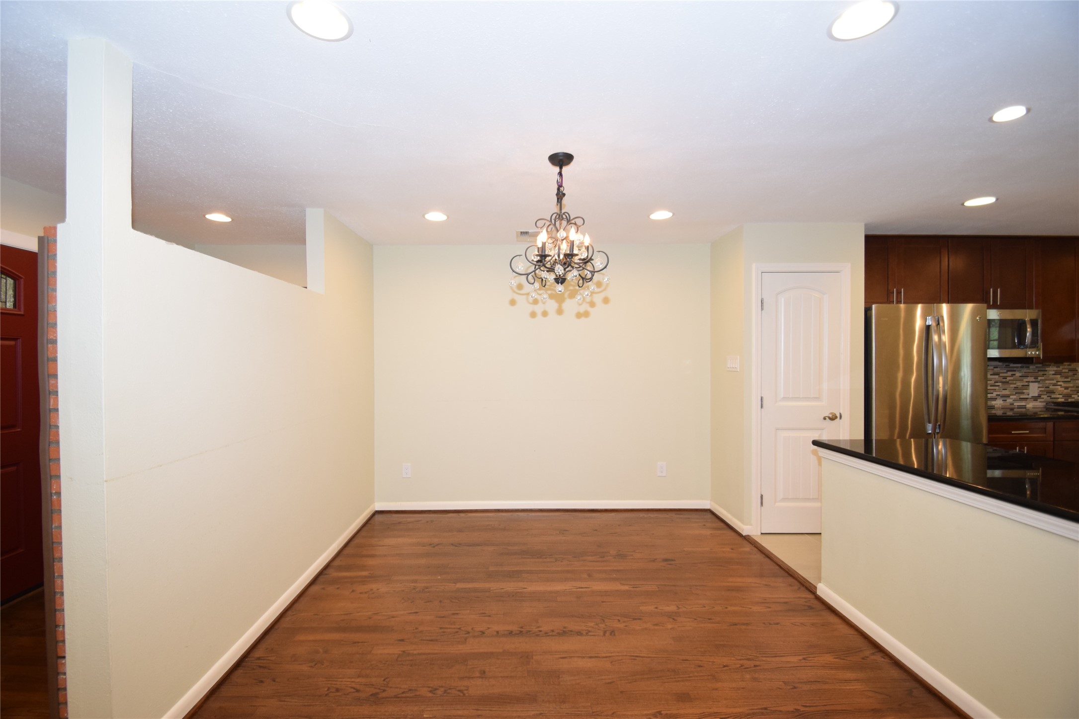 8434 Bluegate Street Houston, TX 77025 - Photo 7 of 28 a view of a kitchen with a sink and refrigerator