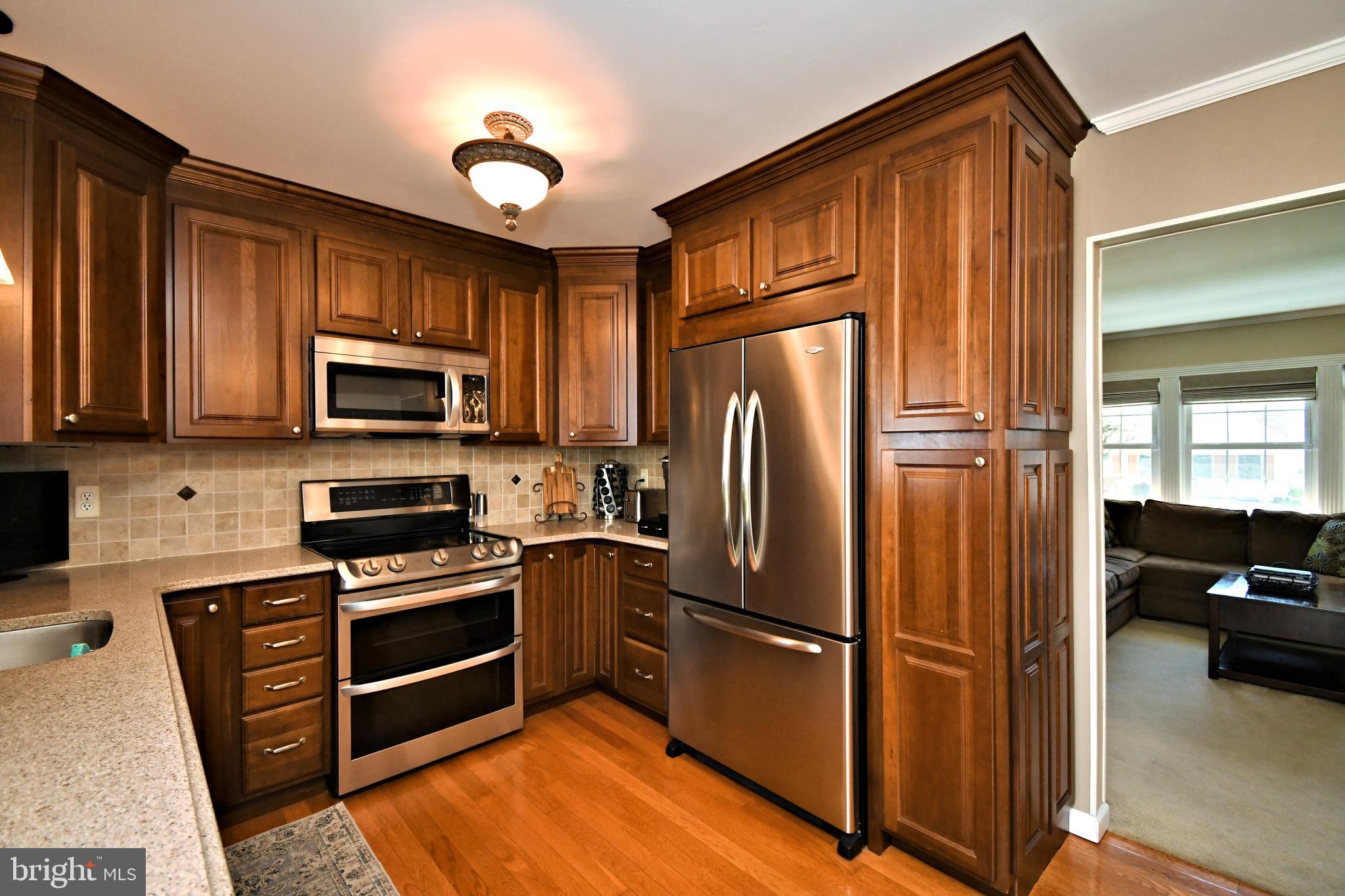20 Conifer Road Levittown, PA 19057 - Photo 13 of 52 a kitchen with stainless steel appliances a refrigerator stove and microwave