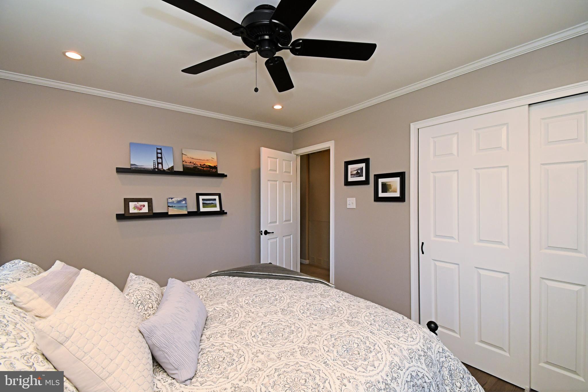 20 Conifer Road Levittown, PA 19057 - Photo 20 of 52 a bedroom with a bed and a ceiling fan