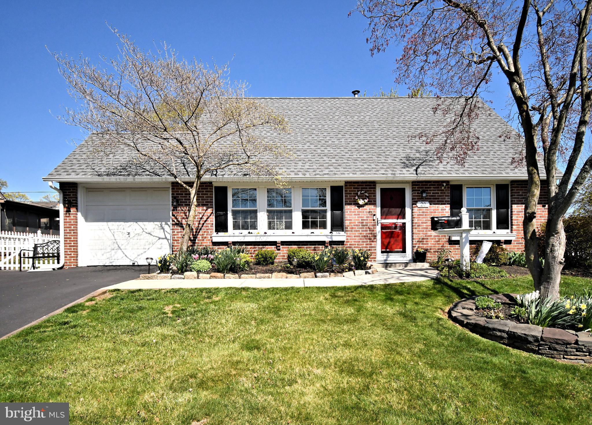 20 Conifer Road Levittown, PA 19057 - Photo 2 of 52 a front view of a house with a yard table and chairs