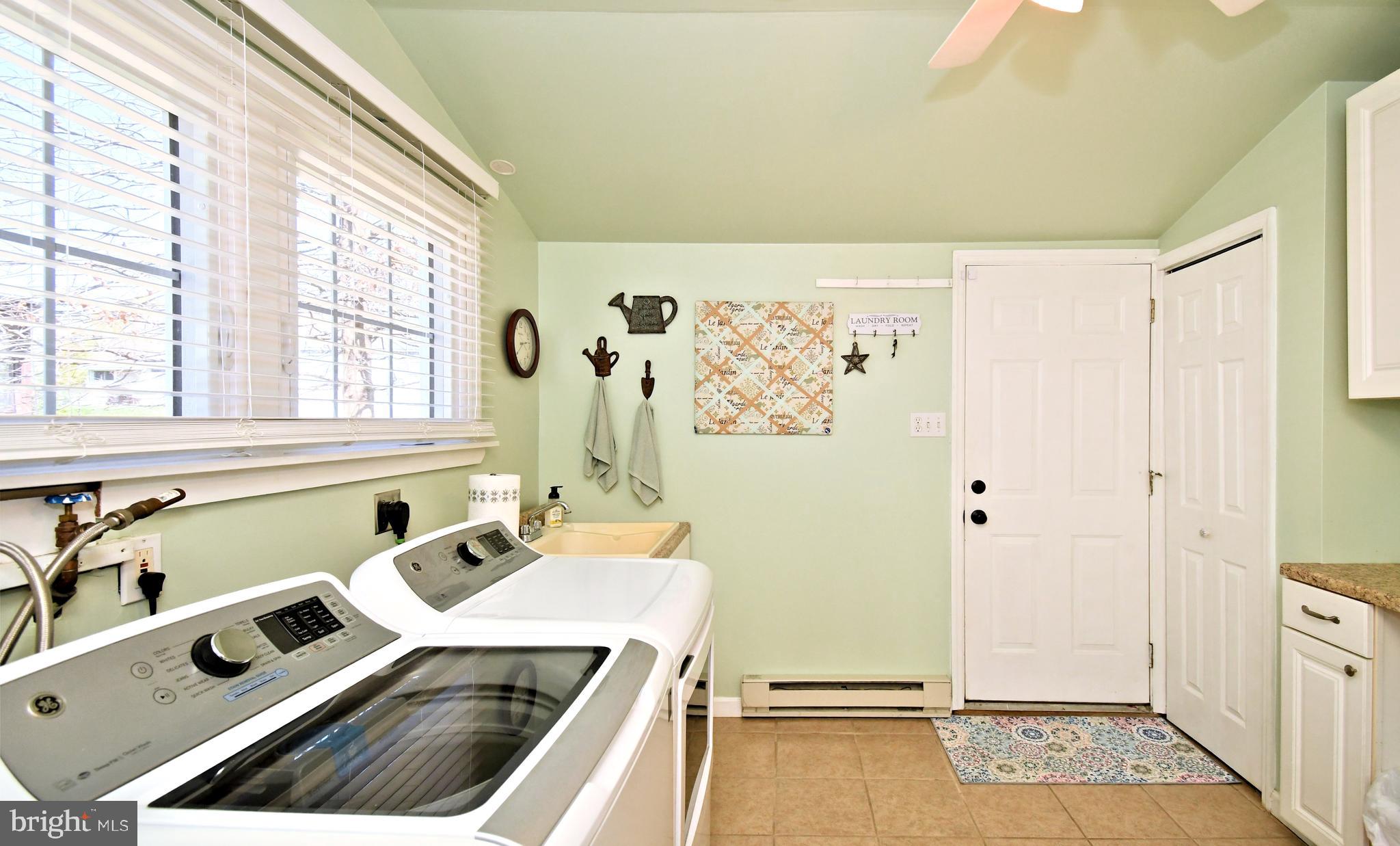 20 Conifer Road Levittown, PA 19057 - Photo 28 of 52 a view of a kitchen with a sink and dishwasher with wooden floor