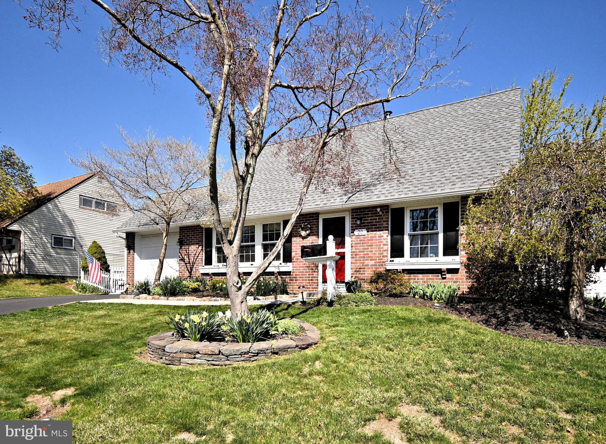 20 Conifer Road Levittown, PA 19057 - Photo 3 of 52 a front view of a house with a yard table and chairs