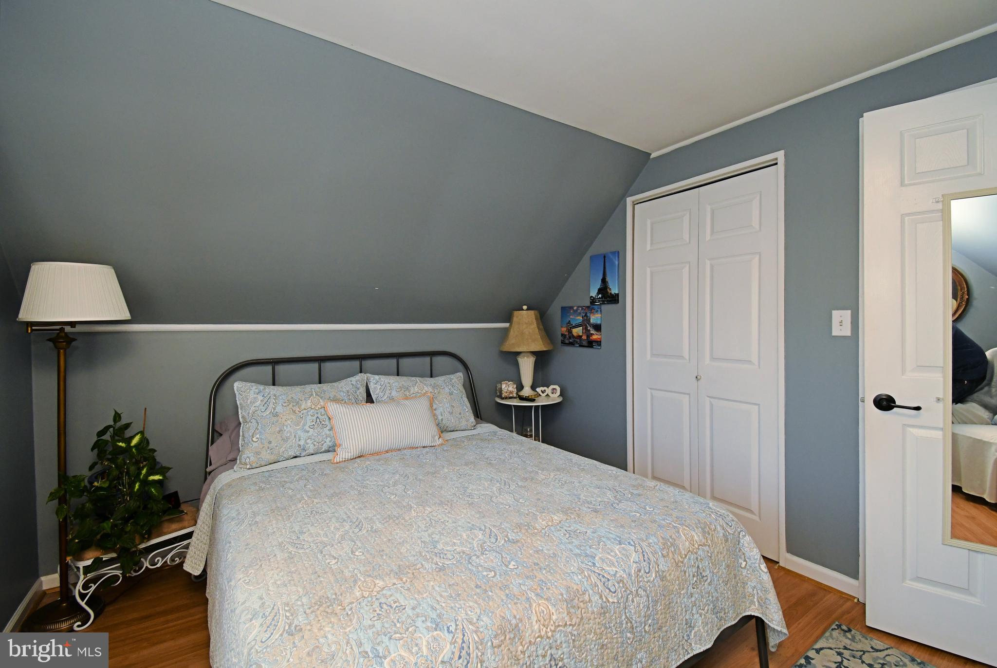 20 Conifer Road Levittown, PA 19057 - Photo 32 of 52 a bedroom with a bed and a potted plant