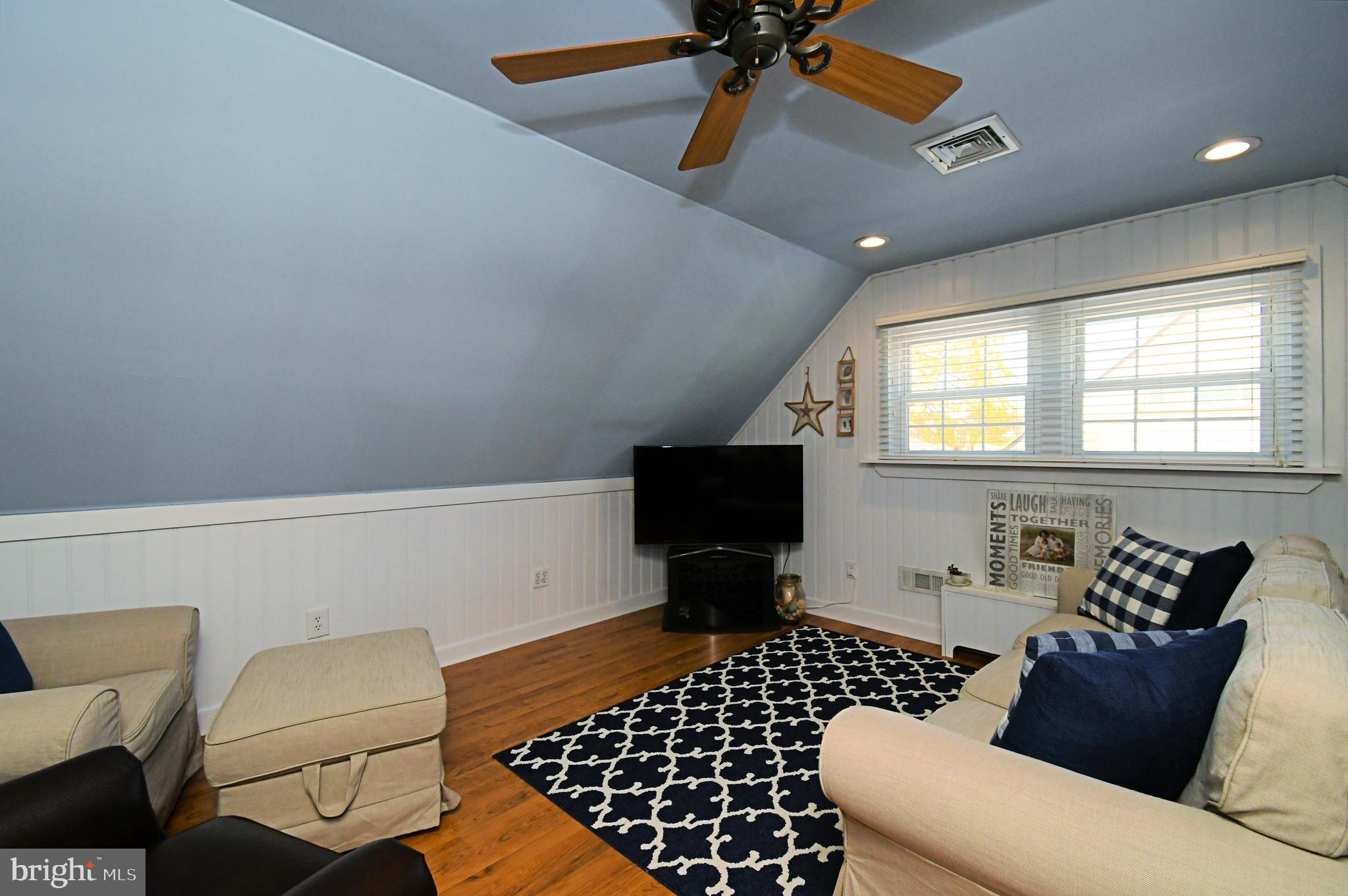 20 Conifer Road Levittown, PA 19057 - Photo 34 of 52 a living room with furniture and a flat screen tv